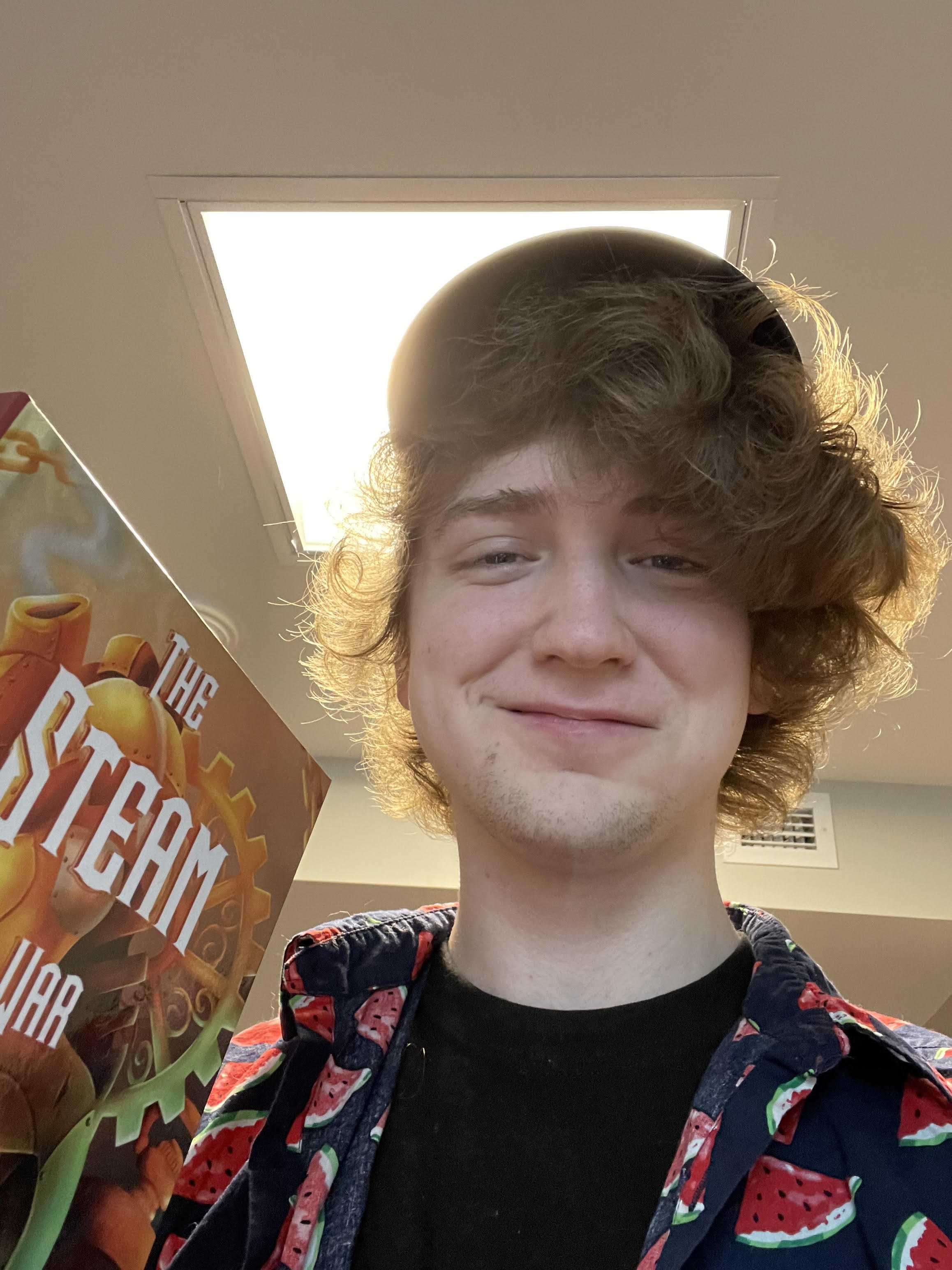 Me holding a copy of The Steam War